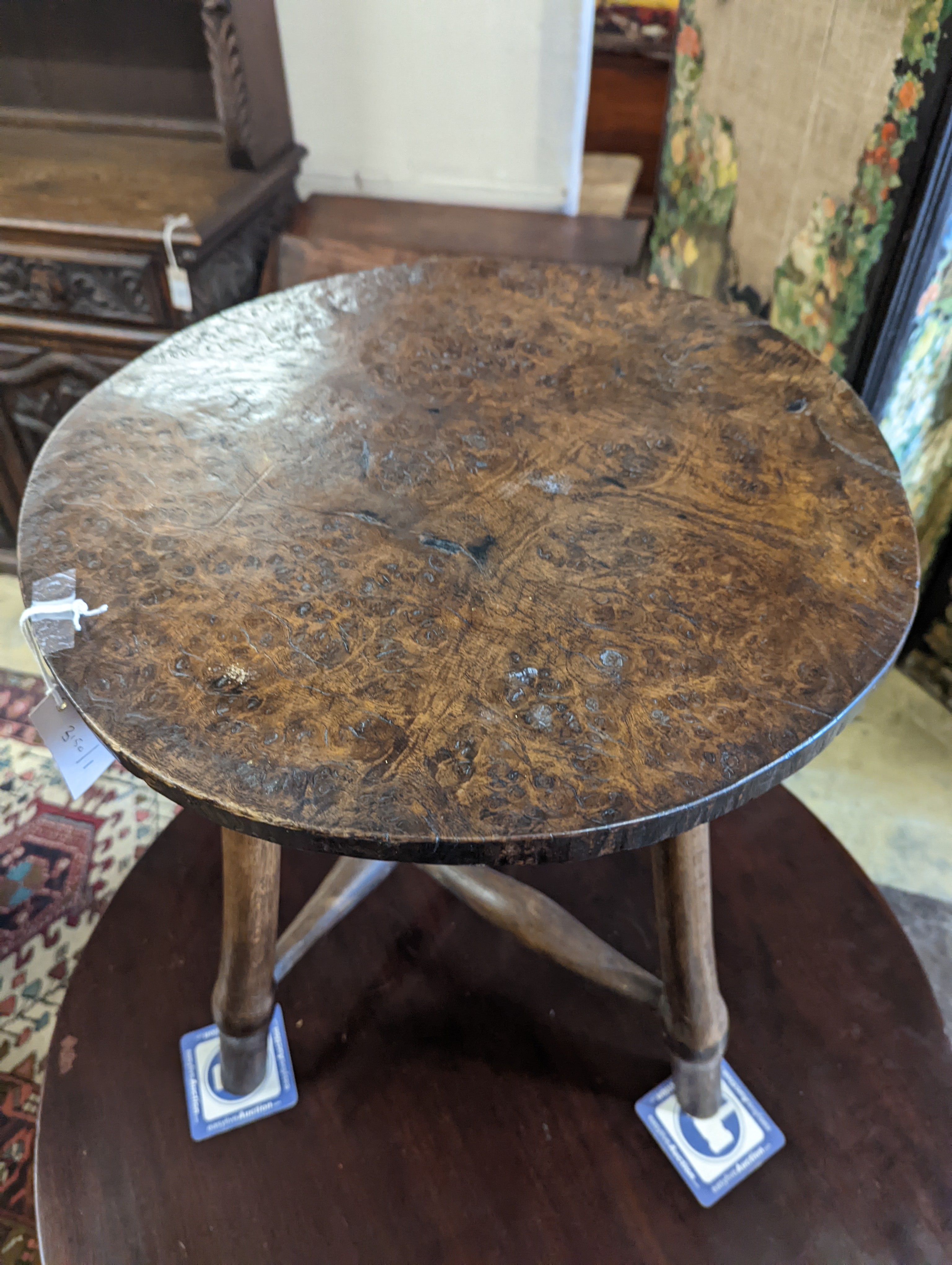 A late 18th / early 19th century circular burr elm and ash cricket table, diameter 60cm, height 62cm